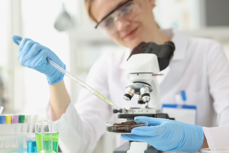 continental-water-health-pharmaceutical Scientist using sterilised water for laboratory tests in a health and pharmaceutical laboratory